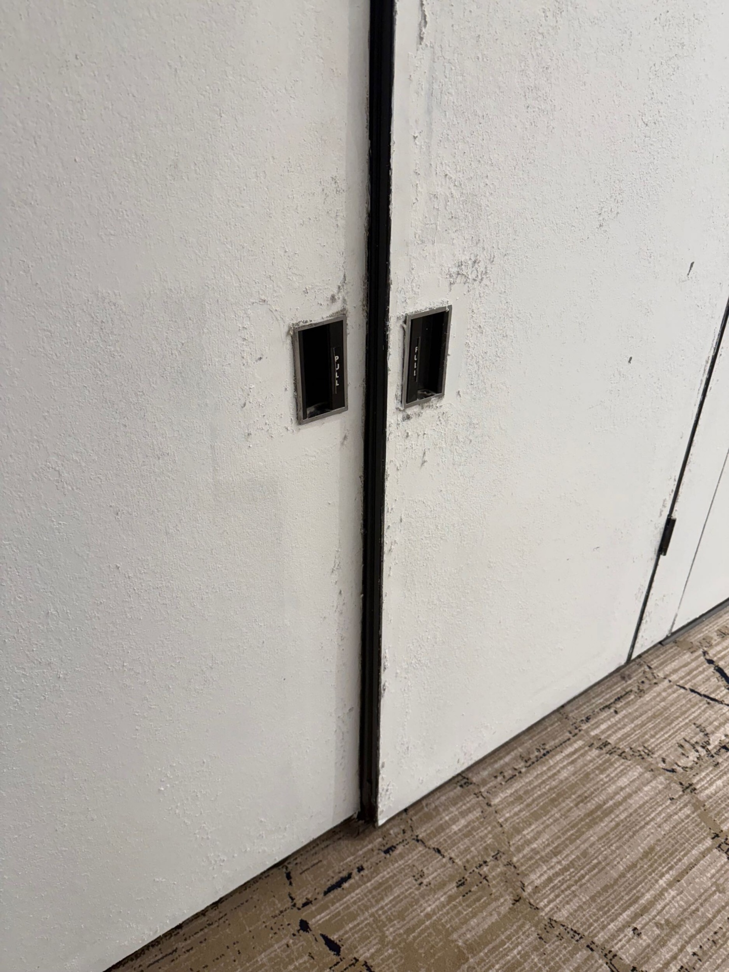 Close up of pass doors painted white