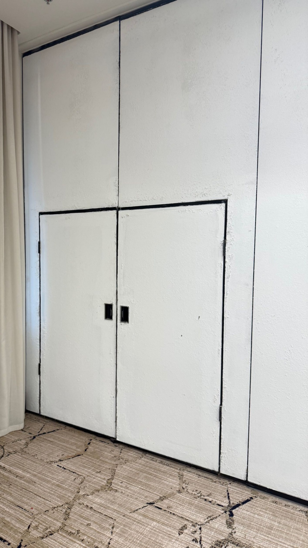 Operable wall that has been painted white.