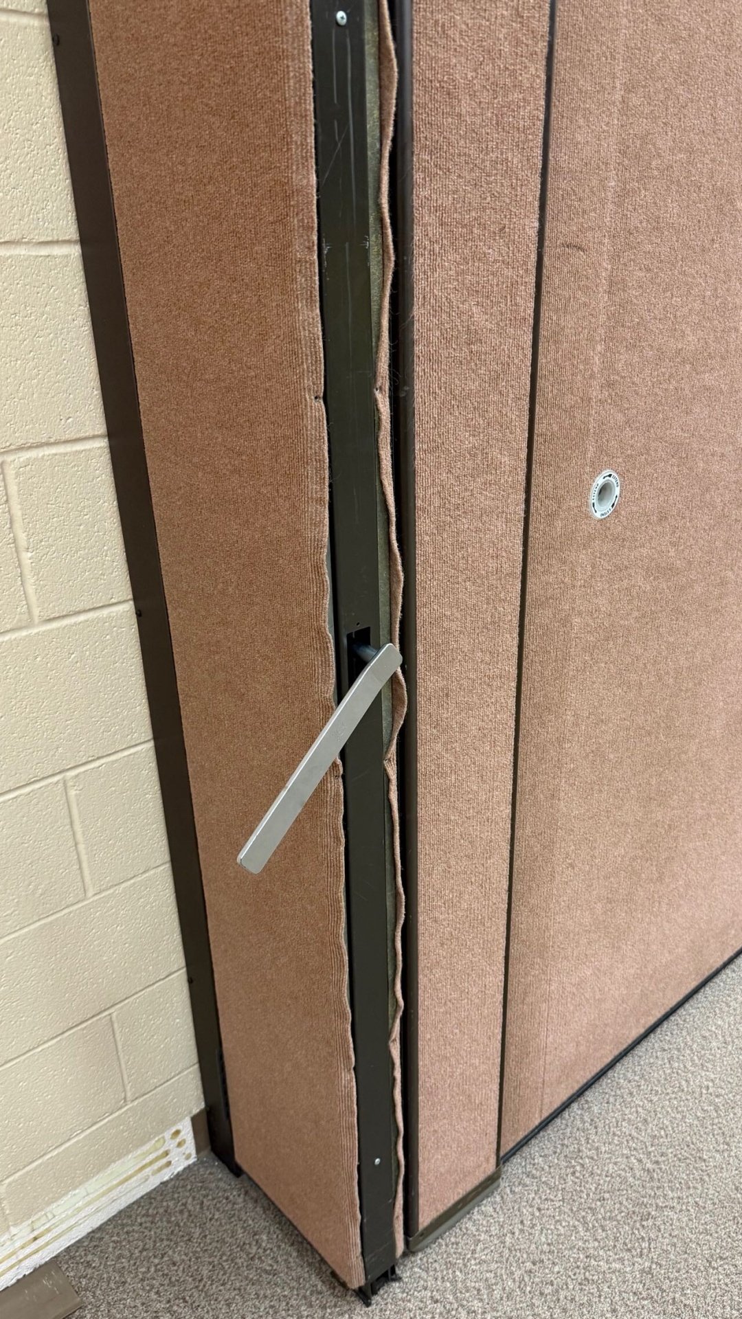 Edge of operable wall panel with wall covering separation